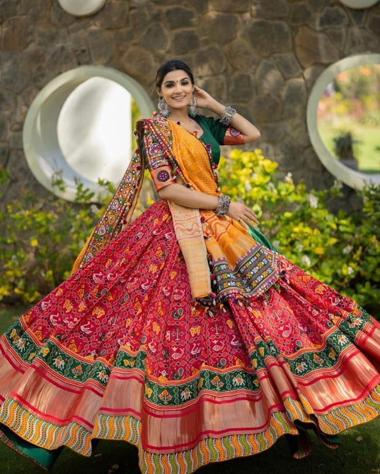 Red Patola Lehenga Choli With Mirror Work And Attached Yellow Dupatta