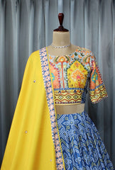 Bandhani Box With Flower Diwan Border Blue Sky Lehenga Choli With Mirror Work And Attached Yellow Dupatta