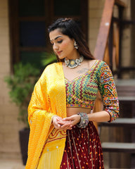 Gamthi Border Print With Bandhani Maroon Lehngha Choli With Mirror Work And Attached Yellow Dupatta